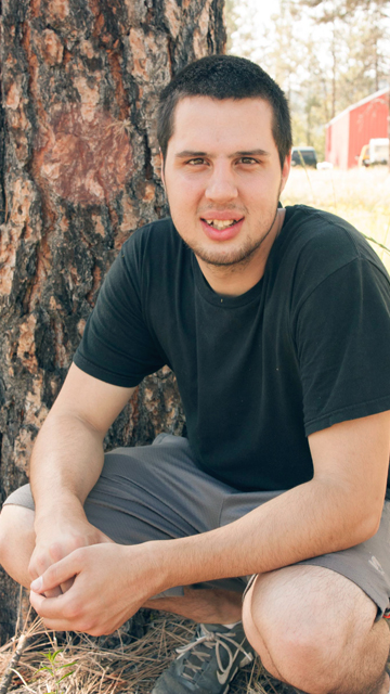 Portrait of Joe by a tree