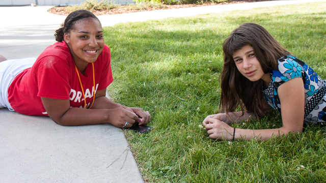 Camp counselor with young girl
