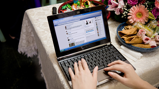 hands typing on a laptop