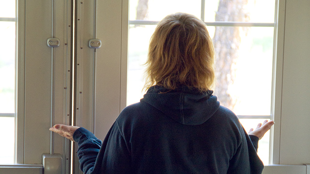 woman-praying-by-window