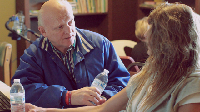 Ron talking with woman