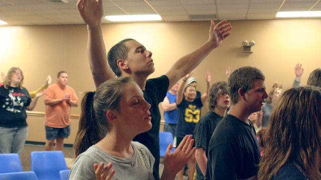 raising hands in worship