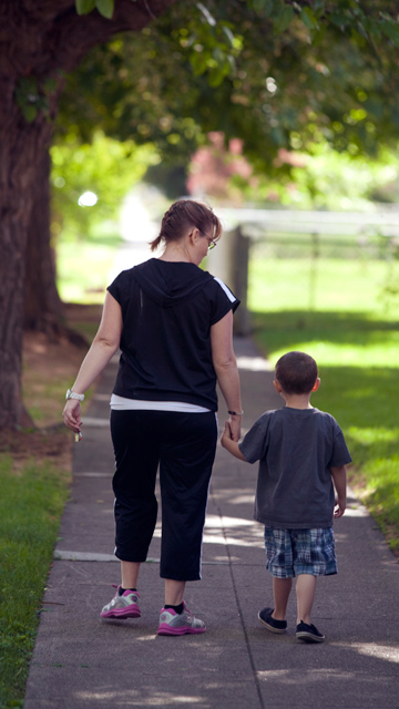 Resident Becca taking a walk with her son