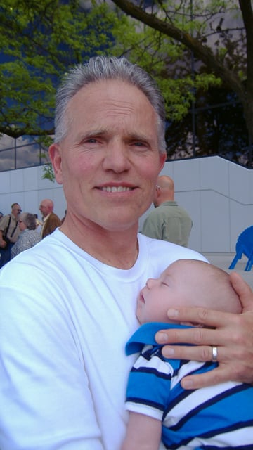 Curt holding his grandson