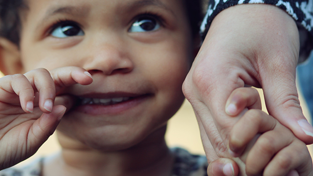 crisis shelter child holding woman's hand