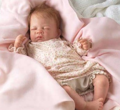 woman loves baby doll as if it were real