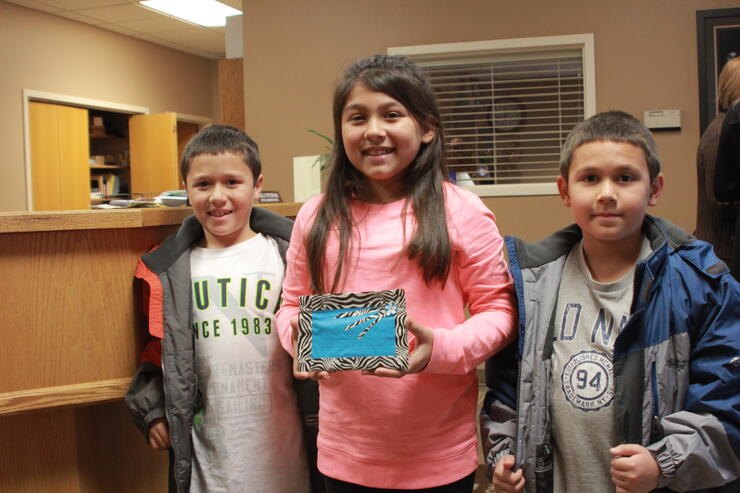 young girl donates money to homeless