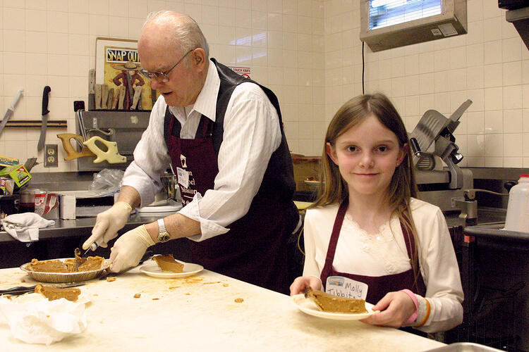 older_man_and_girl_serving