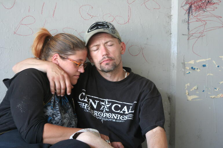 homeless couple struggling