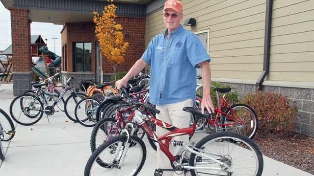 Volunteer Bob fixes bikes