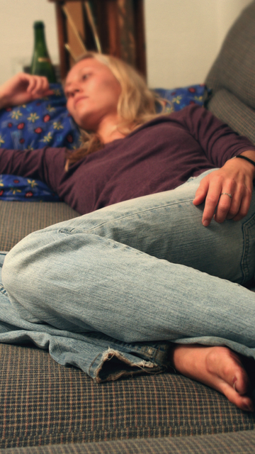 woman lying on couch