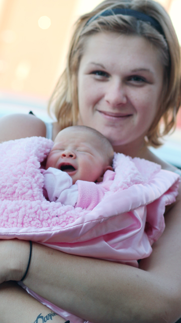 Mom holding newborn Mom holding newborn