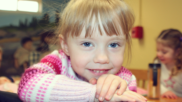 Little blonde girl smiling