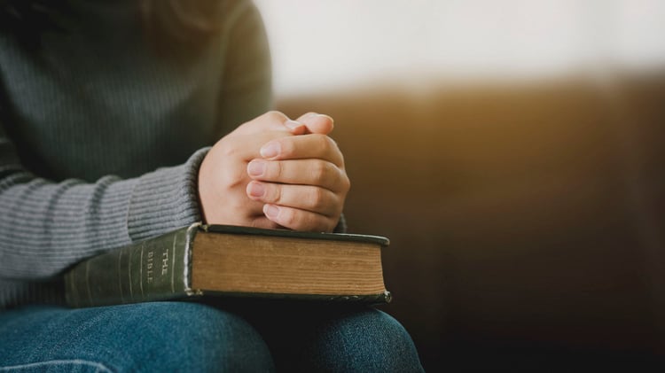praying hands on bible-blog