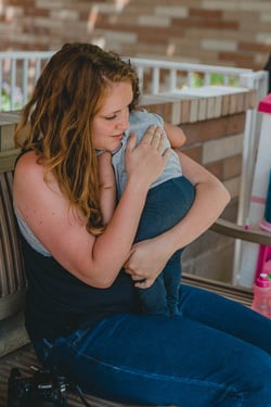 mother holding her child at Anna Ogden Hall