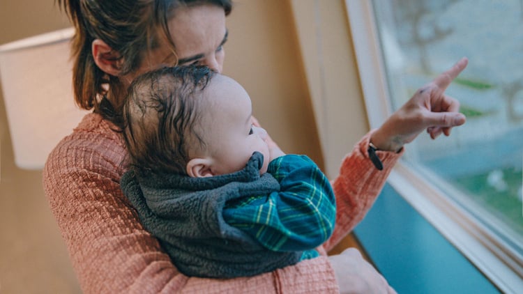 mother at Crisis Shelter holding her baby