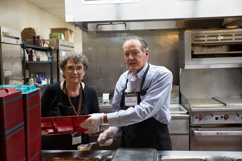 Paul and Virginia help the homeless by serving meals at UGM.