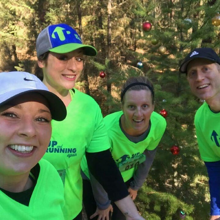 Aeriell, Heather, Amy and Coach Kelly Klossner celebrate finishing a half-marathon.