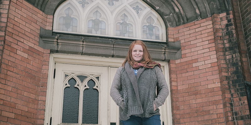 Charity in front of church