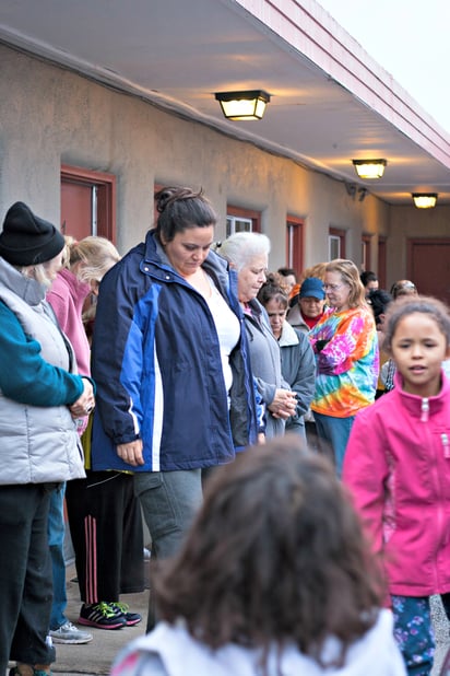 Women standing in line at shelter Women standing in line at shelter