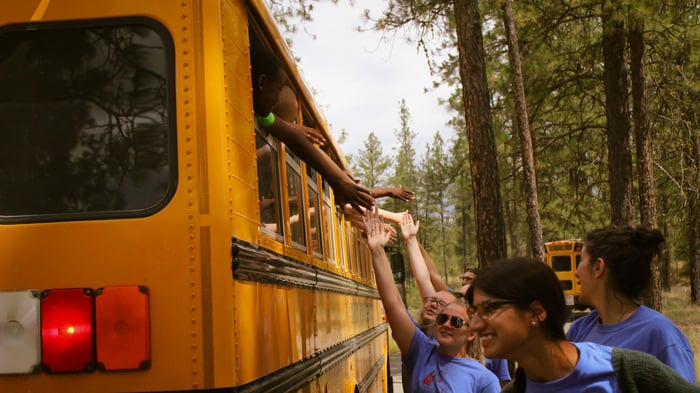 camp busses rolling in