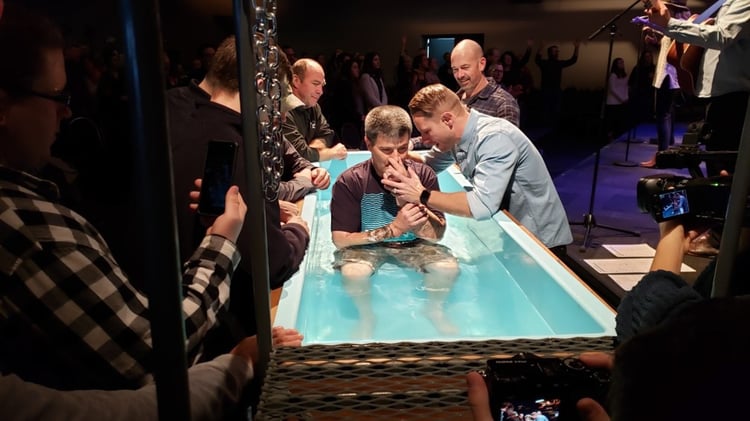 James about to be baptized