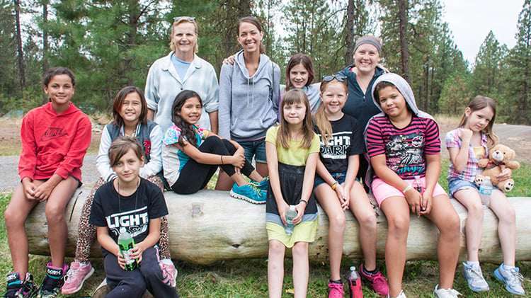 Jaylissa (in stripes and hood) was a “shy little kid” before connecting with cabin mates and counselors at UGM Camp.