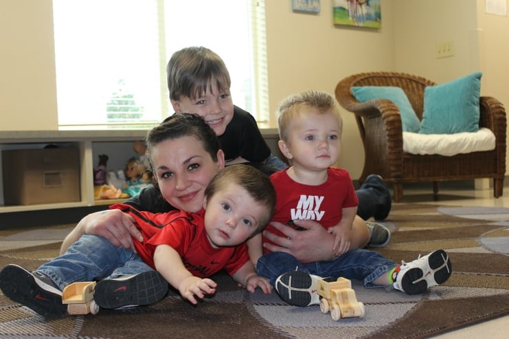 Katie and kids on floor.jpg