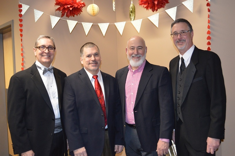 Matt Cage, left, is one of the UGM staff who helps provide a positive male presence to the women and children at the Center.