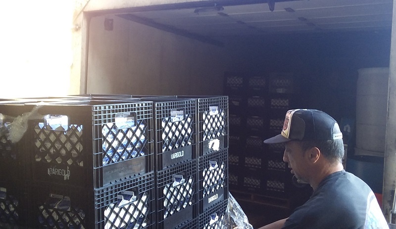 Rick helps load milk donated by Darigold,  one of UGM's food partners, into our truck.