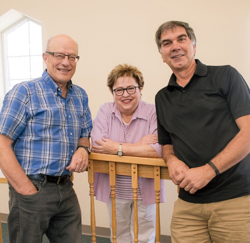 Sonny Westbrook serves at UGM with Executive Assistant MaryBeth Salisbury and Executive Director Phil Altmeyer.