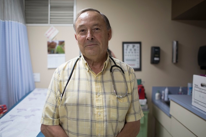 Dr. Ward Merkeley volunteers in the UGM medical clinic.