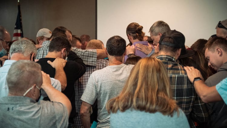 Praying over Robert after Phase Promotion