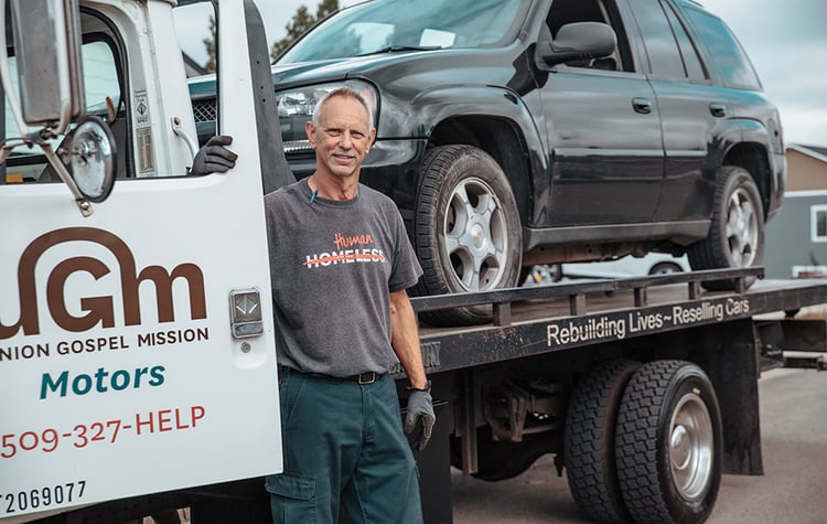 Rick Schwartz drives the UGM Motors donation tow truck.